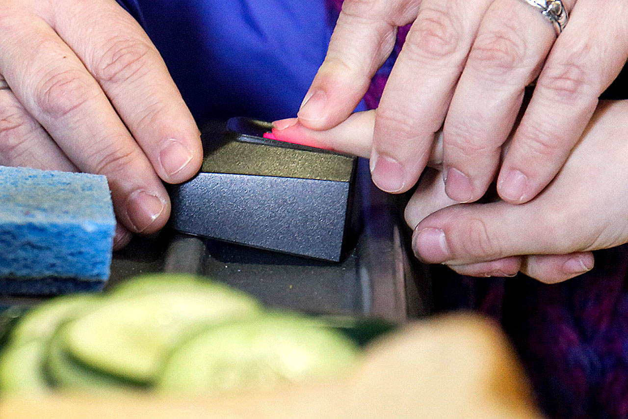 Kids pay for school lunches with the scan of a finger