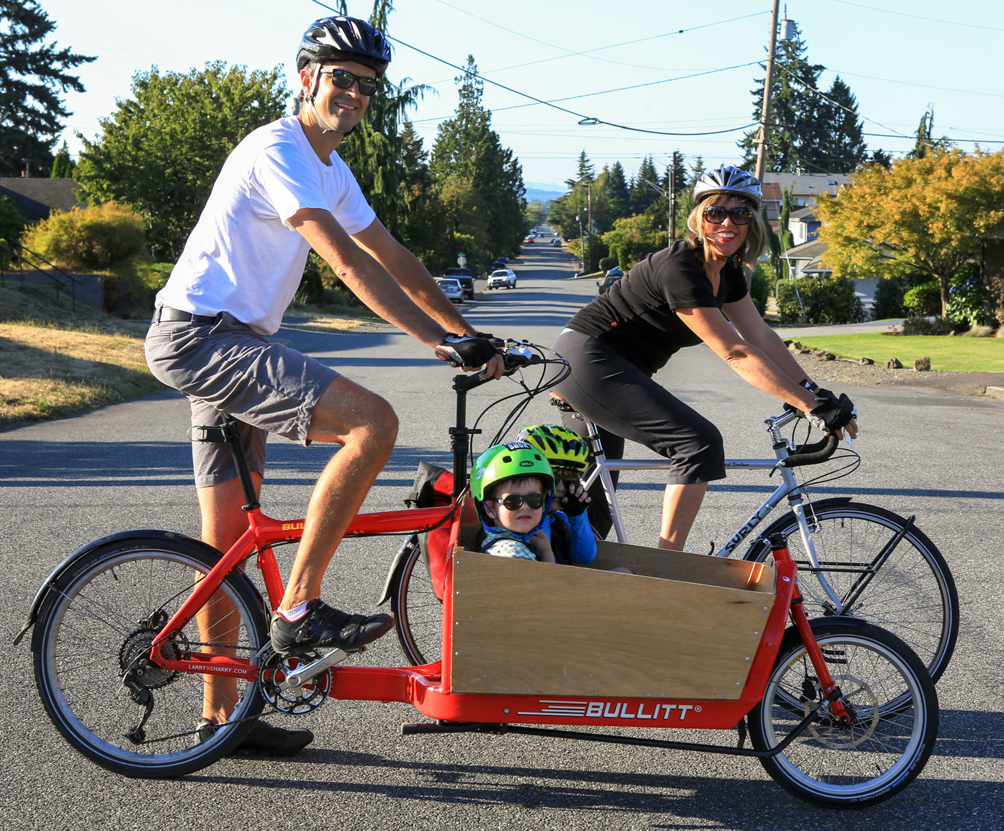 In this photo from last summer, Tyler and Brittney Rourke get ready to head out on a bike ride with sons Bryan and Reece. The family will help lead a tour of Everett’s fire stations on Saturday. (Herald file photo by Kevin Clark)