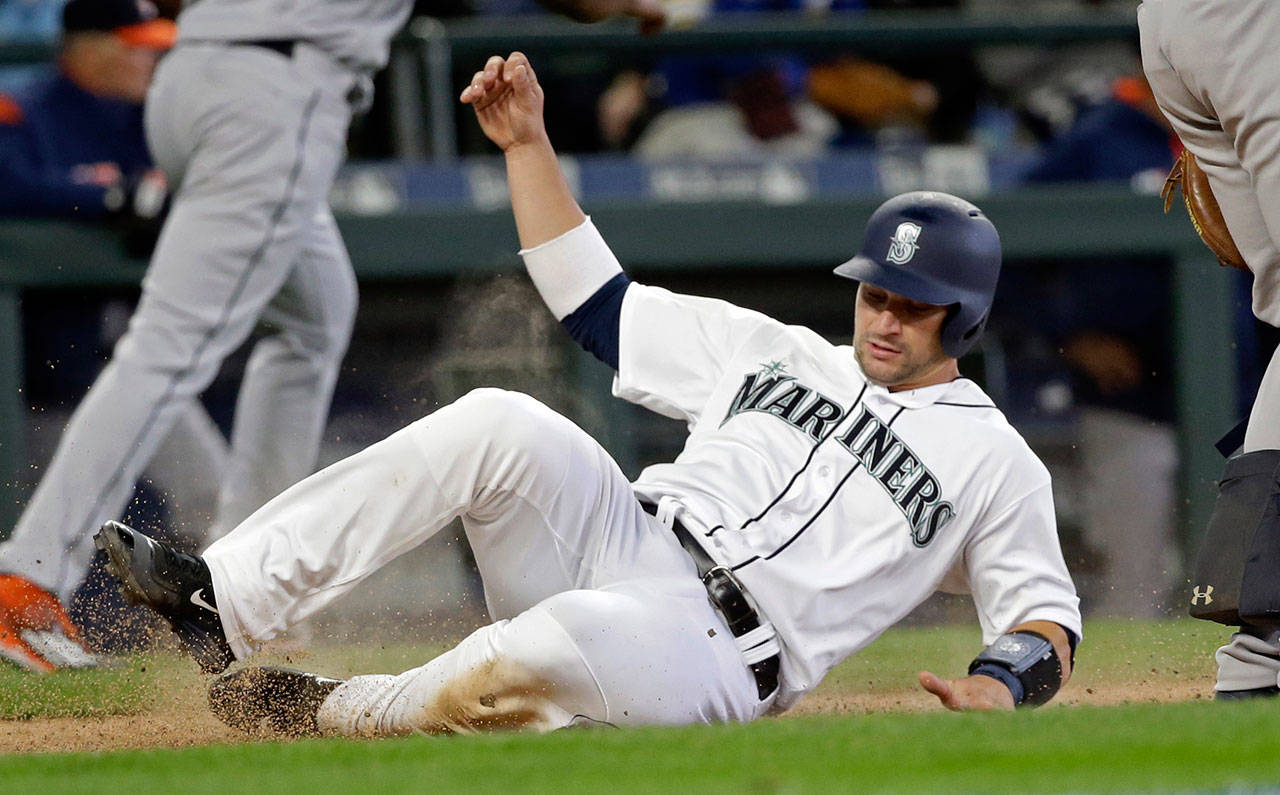 Seattle’s Mike Zunino scores a run during Monday’s game in Seattle. (AP Photo/Elaine Thompson)