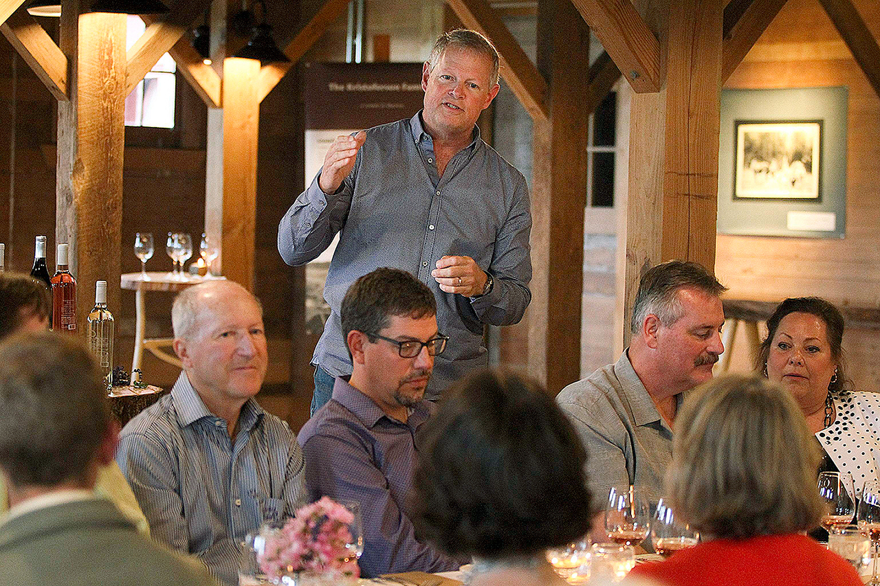 Kris Kristoferson speaks to guests at a farm dinner at Kristoferson Farms on Camano Island last year. (Ian Terry / The Herald)