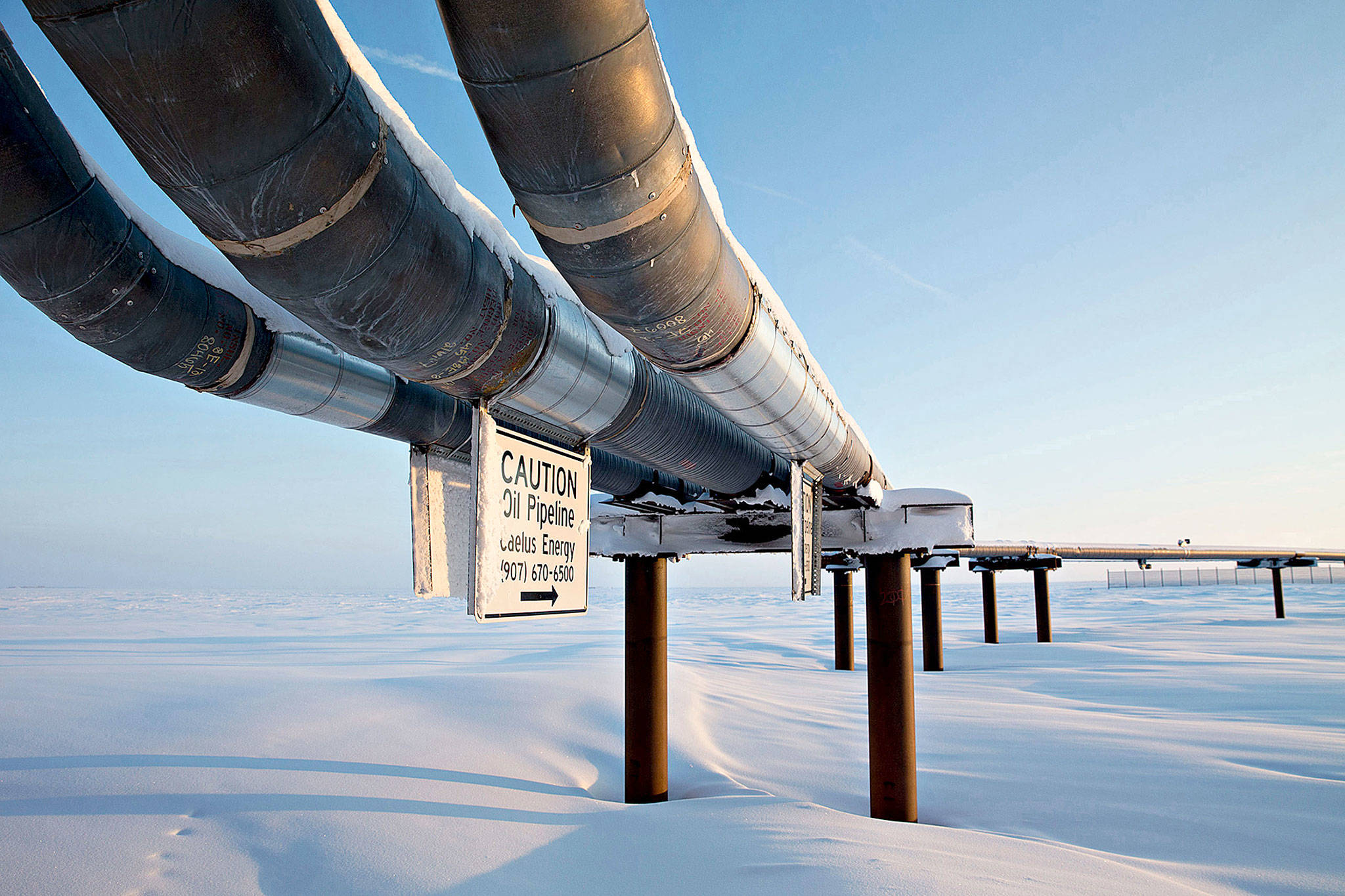 An oil pipeline is seen in February on a six-acre gravel island in the Beaufort Sea that’s home to several producing oil wells on the North Slope in Harrison Bay, Alaska. (Daniel Acker / Bloomberg)