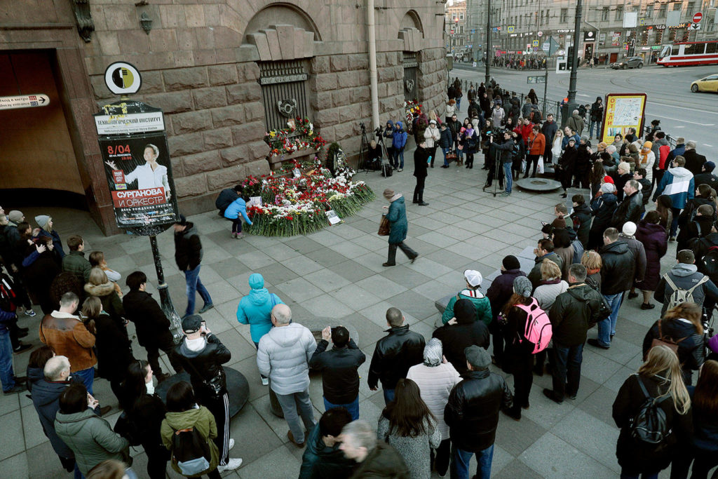 People gather at a impromptu memorial at Technologicheskiy Institute subway station in St. Petersburg, Russia, on Tuesday. A bomb blast tore through a subway train deep under Russia’s second-largest city on Monday. (AP Photo/Dmitri Lovetsky) 
