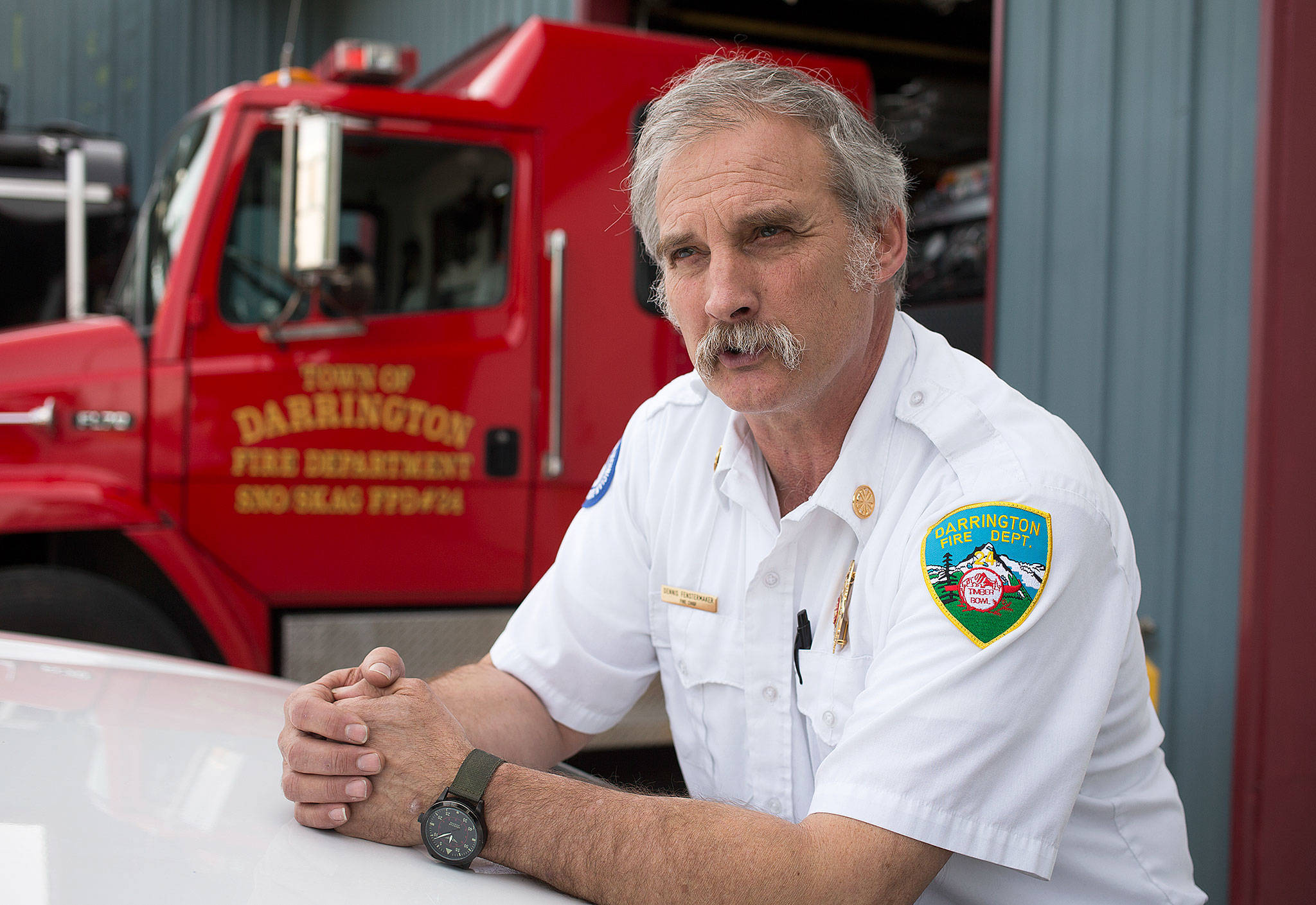 Most of the volunteers at the Darrington Fire Department have jobs out of town, Chief Denny Fenstermaker says. During a highway closure, they might decide to stay away — leaving fewer crew members in Darrington, should there be a fire. (Andy Bronson / The Herald)