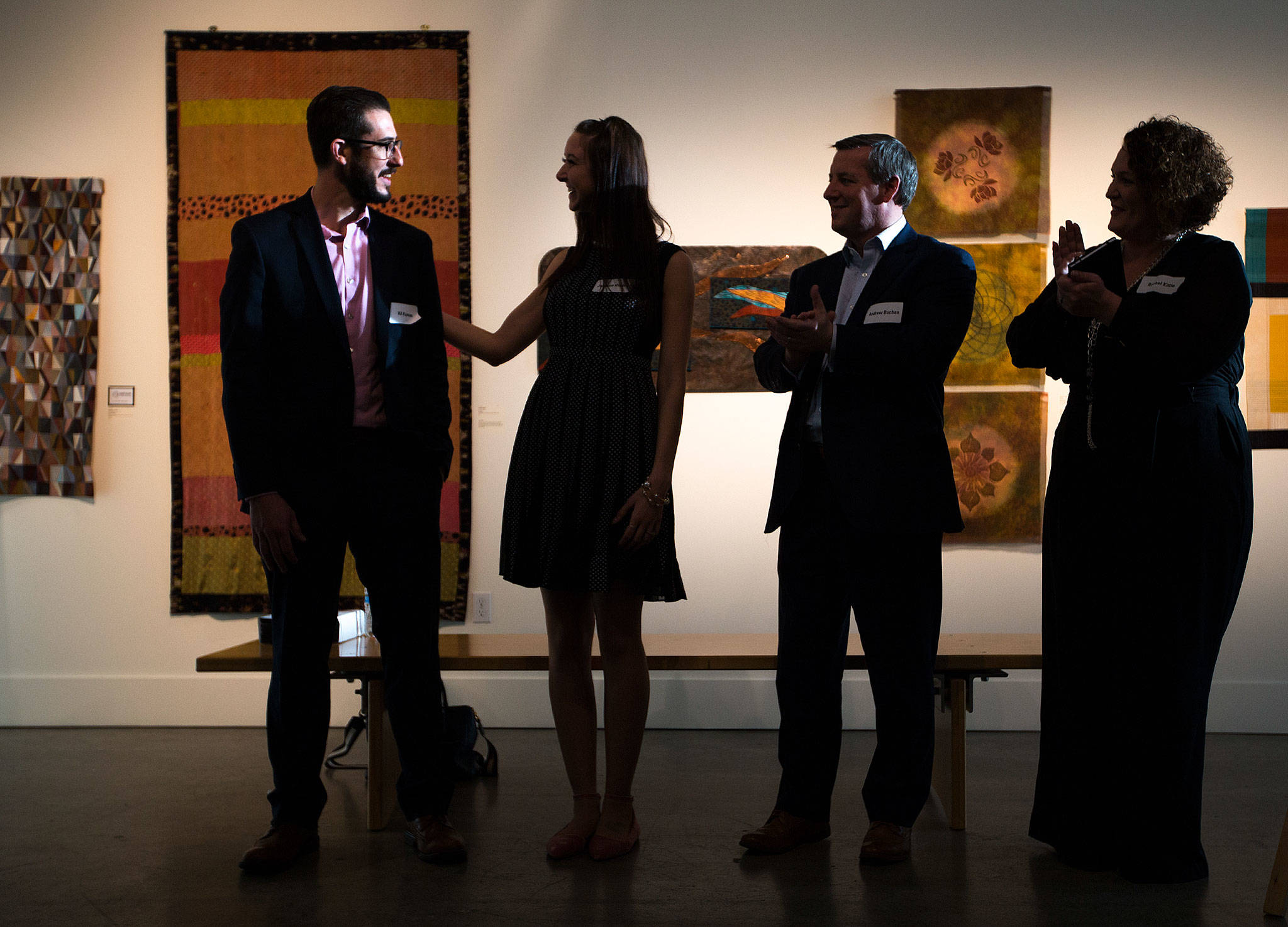 The evening sun falls on the face of Hil Kaman, city of Everett’s public health and safety director, left, as he is named the recipient of this year’s Emerging Leader award at a reception at the Schack Art Center in downtown Everett on Thursday. (Andy Bronson / The Herald)                                The evening sun falls on the face of Hil Kaman, city of Everett’s public health and safety director, left, as he is named the recipient of this year’s Emerging Leader award at a reception at the Schack Art Center in downtown Everett on Thursday. (Andy Bronson / The Herald)