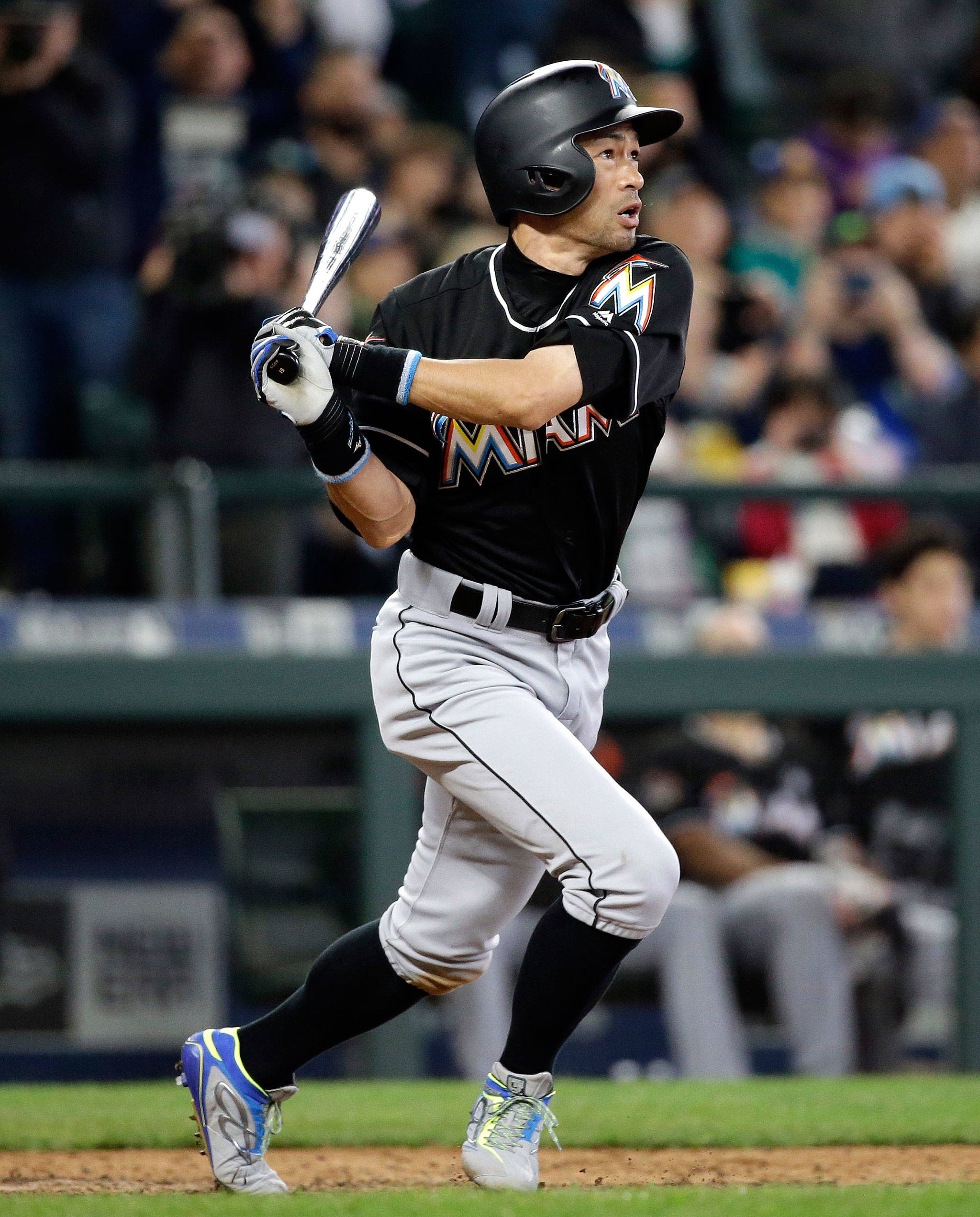 Ichiro Suzuki of the Miami Marlins hits a home run against the Mariners in the ninth inning of Wednesday’s game at Safeco Field in Seattle. (AP Photo/Elaine Thompson)