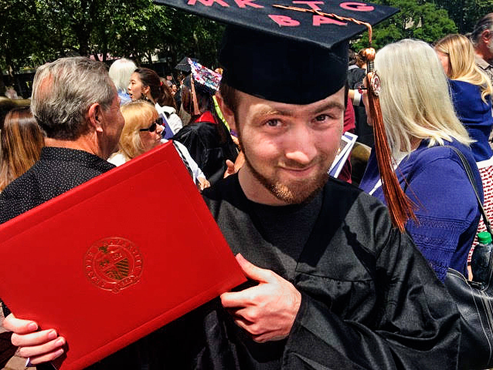 Jacob Peterson after his graduation ceremony at Seattle University in June. Peterson, who grew up in Marysville, was 6 when he underwent a heart transplant in 2000. He died April 10 at age 22.                                (Peterson family photo)
