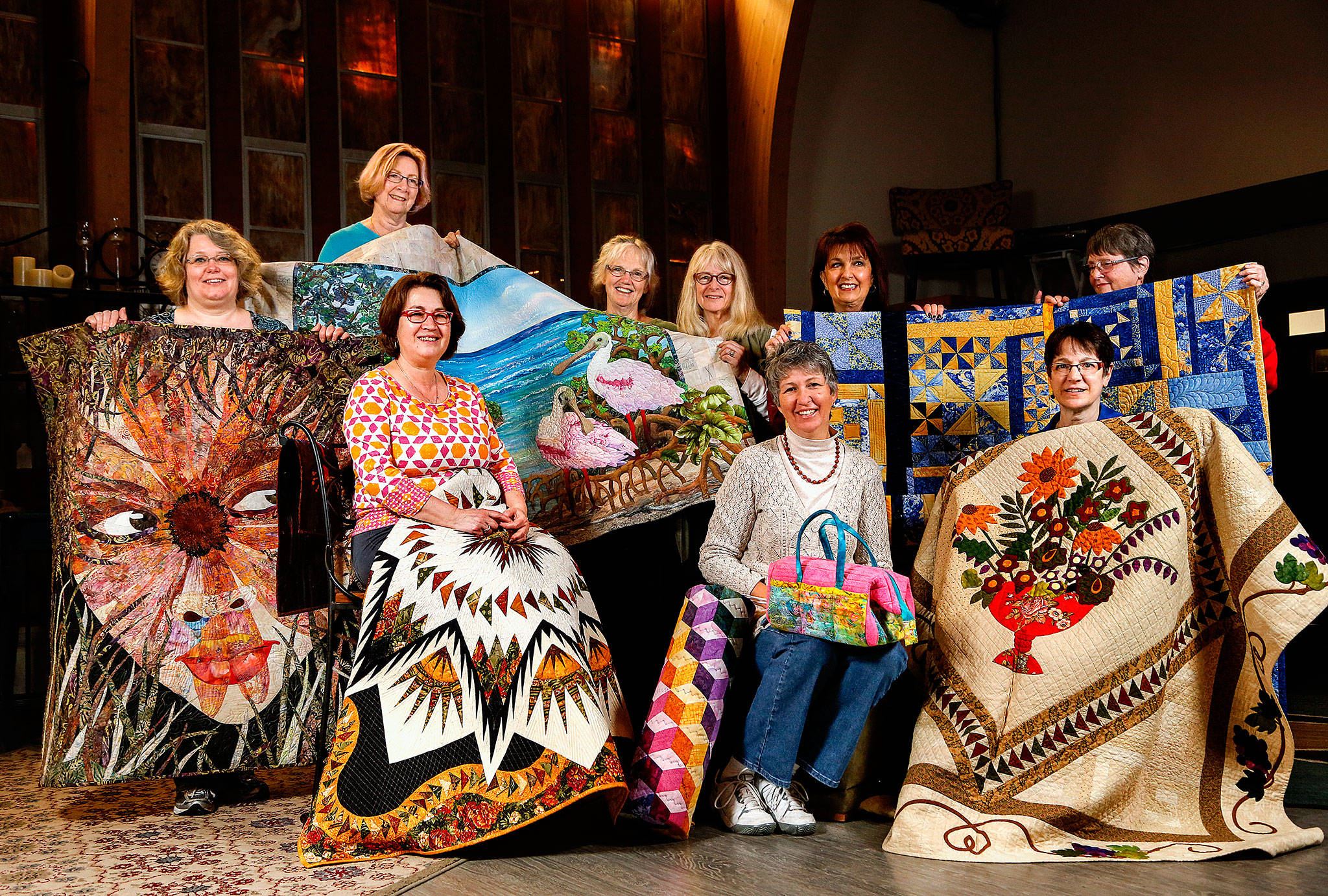 A first-ever Everett Quilt Show is scheduled for Friday and Saturday at Xfinity Arena conference center. It’s presented by some extraordinarily talented quilters in the Marysville-based All in Stitches Quilt Guild. They met Tuesday at the Living Room Coffee House, bringing with them a few masterpieces. From left are Tammy Mohiswarnath, Grace Hawley, Becky Ray, Kathy McNeil, Cathryn Scott, Shawna Gould, Darlene McCourt, Vicki Hesseltine and Shirley Rock. (Dan Bates / The Herald)