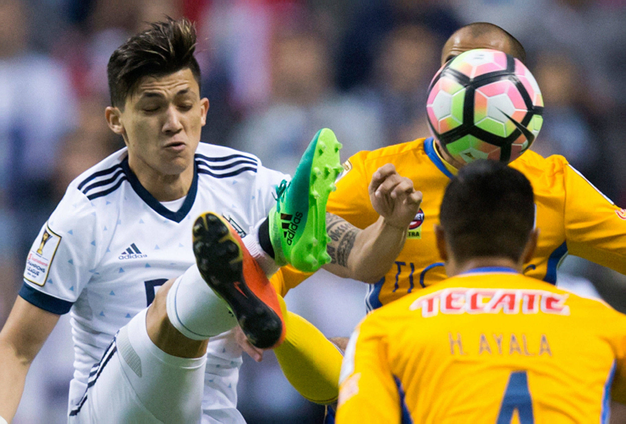 Fredy Montero of the Vancouver Whitecaps (left) and Tigres’ Guido Pizarro vie for the ball during the second leg of their CONCACAF Champions League soccer semifinal April 5 in Vancouver, British Columbia. (Darryl Dyck/The Canadian Press via AP)