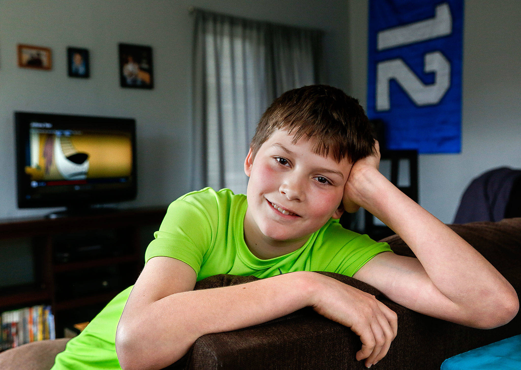At his home in Snohomish, Jonah Urie, 11, talks about rescuing a drowning toddler this weekend at the Snohomish Aquatic Center. (Dan Bates / The Herald)