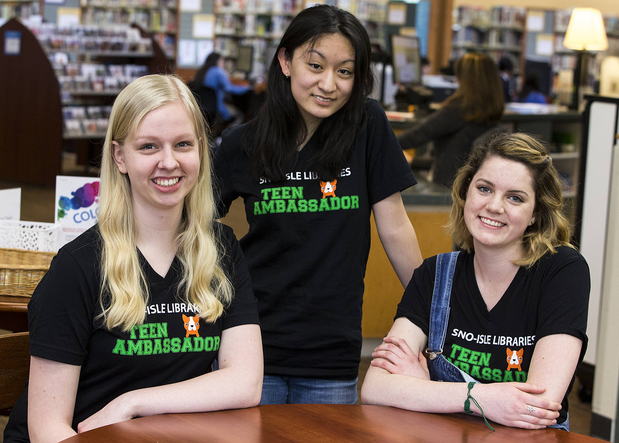 Sno-Isle Libraries Teen Ambassadors (from left) Caroline Kulits, 15, Angie Wang, 16, and Laura Campbell, 17, help create blog posts and volunteer at local library events as part of the youth program. (Ian Terry / The Herald)