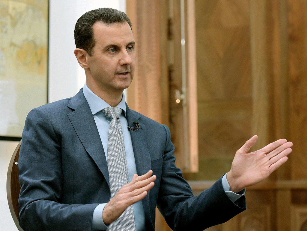 In this Feb. 10, 2017, photo released by the Syrian official news agency SANA, Syrian President Bashar Assad speaks during an interview with Yahoo News in Damascus, Syria. (SANA via AP, File) 
