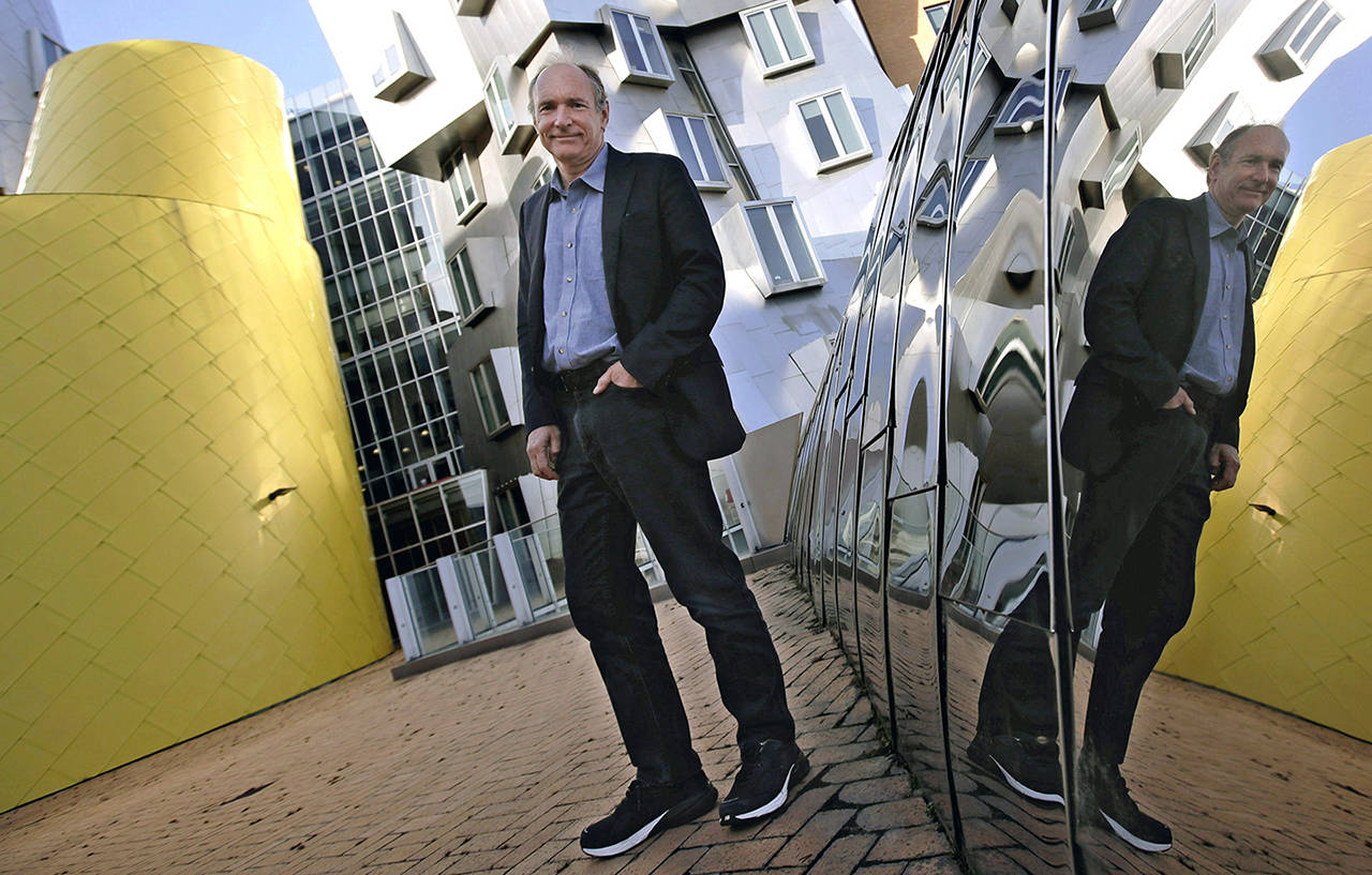 In this Monday April 3 photo, Tim Berners-Lee poses outside his office at the Massachusetts Institute of Technology in Cambridge, Massachusetts. (AP Photo/Charles Krupa)