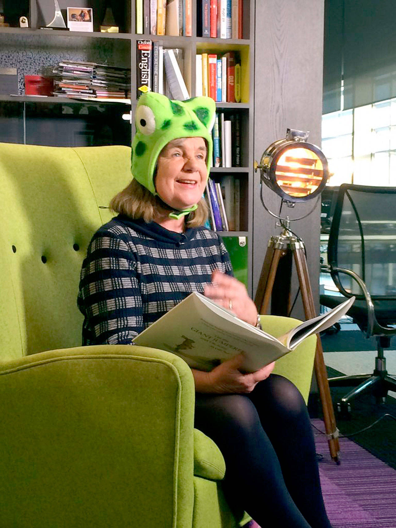 Author Julia Donaldson, in a Jumperee frog hat, reads a story. (Photo courtesy of Penguin Young Readers)