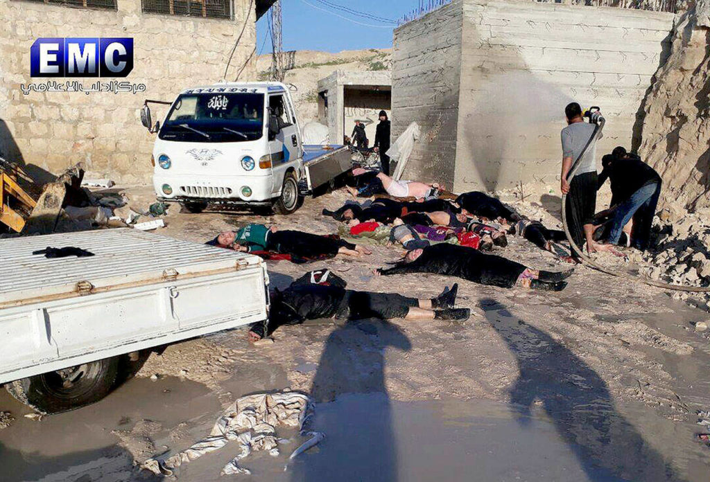 This photo provided by the Syrian anti-government activist group Edlib Media Center, which has been authenticated based on its contents and other AP reporting, shows victims of a suspected chemical attack Tuesday in the town of Khan Sheikhoun, northern Idlib province, Syria. (Edlib Media Center, via AP) 
