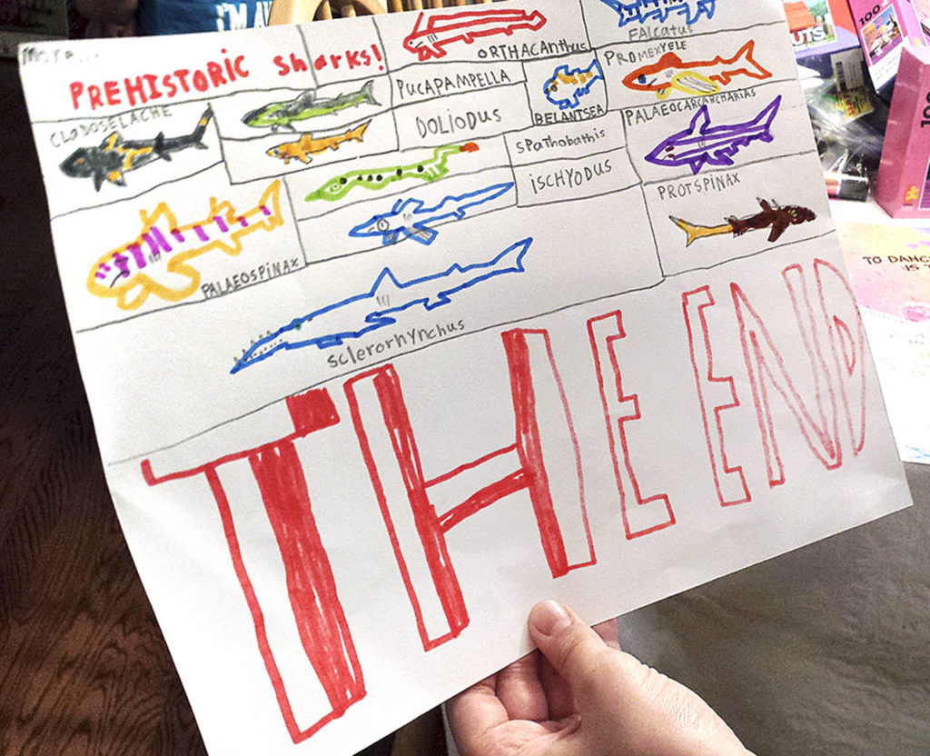 J.T. Fisher has made learning about sharks a personal passion and has dozens of books on the topic. Here he has drawn some types of prehistoric sharks. (Sharon Salyer / The Herald)
