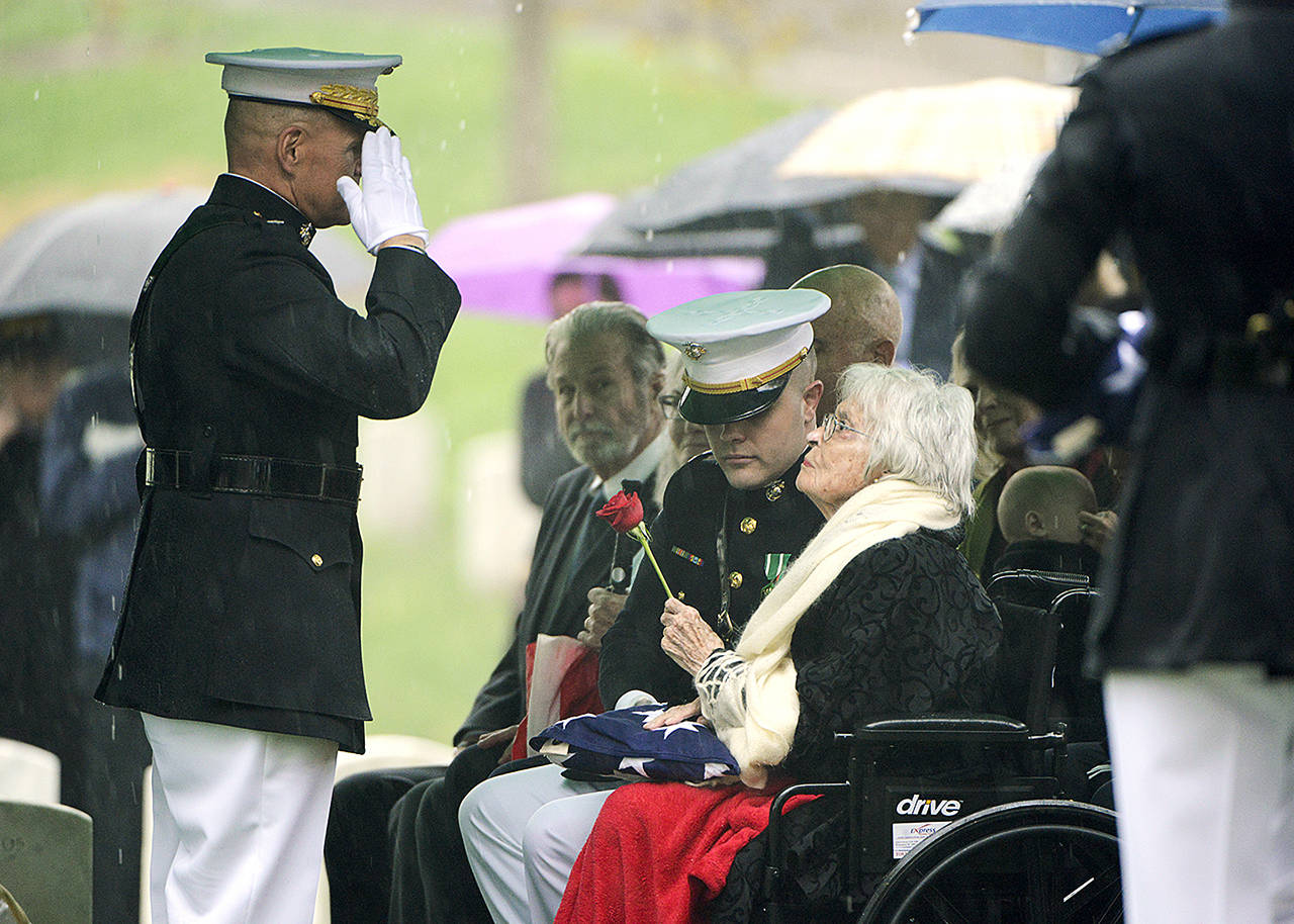 Marine Corps Commandant Gen. Robert B. Neller (left) salutes Annie Glenn, widow of John Glenn, following the American flag presentation during the graveside service for Glenn at Arlington National Cemetery in Arlington, Virginia, on Thursday, April 6. Glenn, who died Dec. 8 at age 95, was laid to rest in a private burial attended by relatives and invited guests. His family scheduled the service for what would have been John and Annie Glenn’s 74th wedding anniversary. (U.S. Army photo by Rachel Larue/Arlington National Cemetery via AP)
