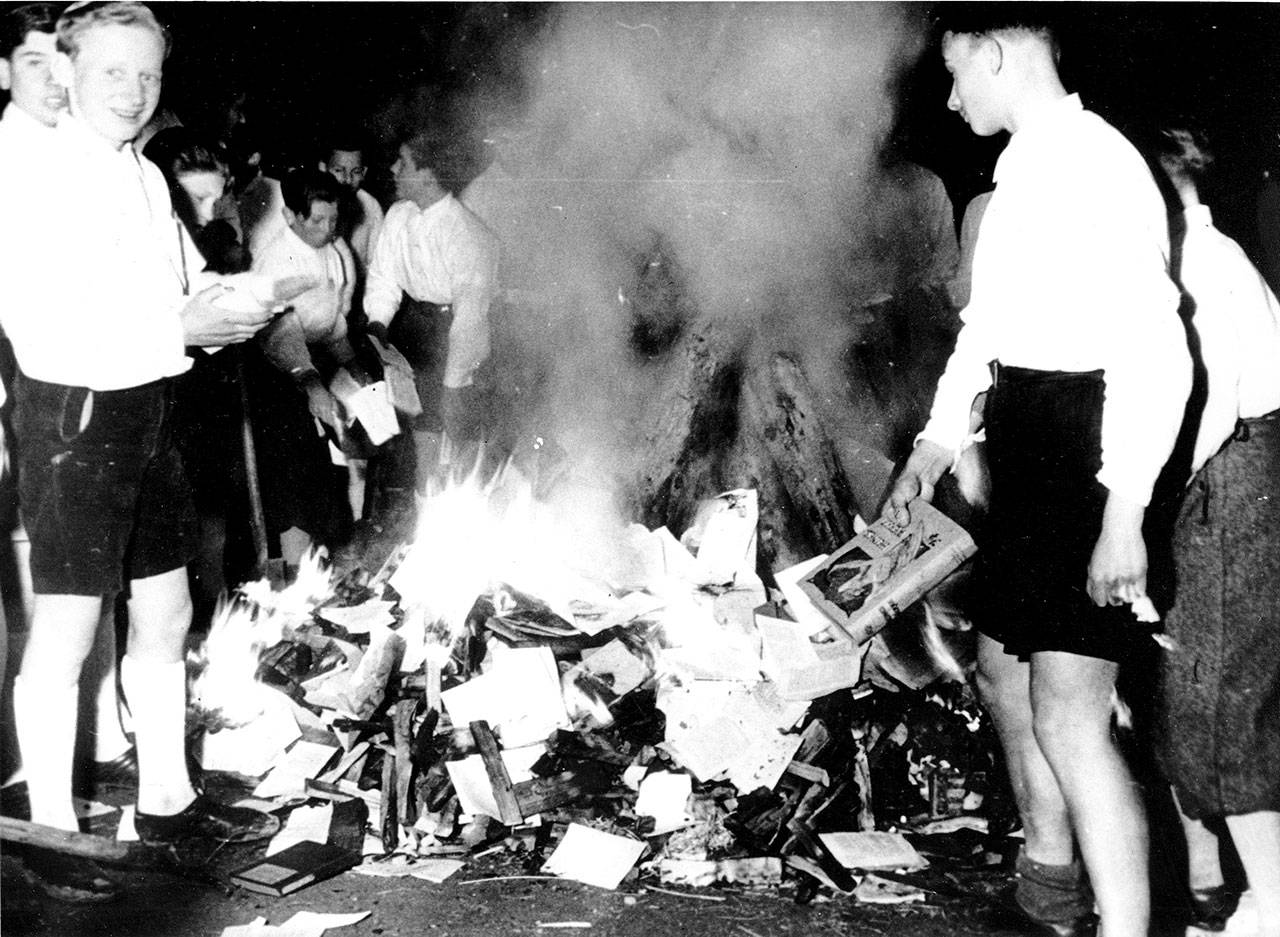 Members of the Hitler Youth burn books condemned as Jewish-Marxist in Salzburg, Austria, on April 30, 1938. (Associated Press archive)