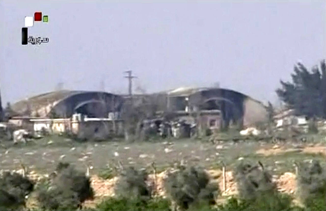 This frame grab, from video provided by the Syrian official TV, shows the burned and damaged hangar warplanes which attacked by U.S. Tomahawk missiles, at the Shayrat Syrian government forces airbase, southeast of Homs, Syria on Friday April, 7. (Syrian government TV, via AP)