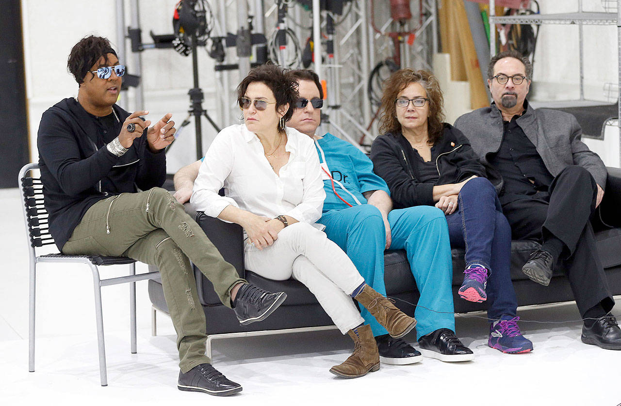 Bassist BrownMark (left) answers a question with the other original members of Prince’s 1980s band, The Revolution, Wednesday in Minneapolis. From second left: guitarist Wendy Melvoin, keyboarders Matt Fink and Lisa Coleman, and drummer Bobby Z. The group is preparing to kick off a spring U.S. tour with a performance Friday, the first anniversary of Prince’s death from an accidental overdose. (AP Photo/Jim Mone)