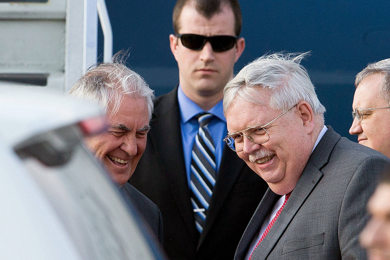 U.S. Secretary of State Rex Tillerson (left) and U.S. Ambassador to Russia John Tefft smile upon arrival in Moscow on Tuesday. (AP Photo/ Ivan Sekretarev)