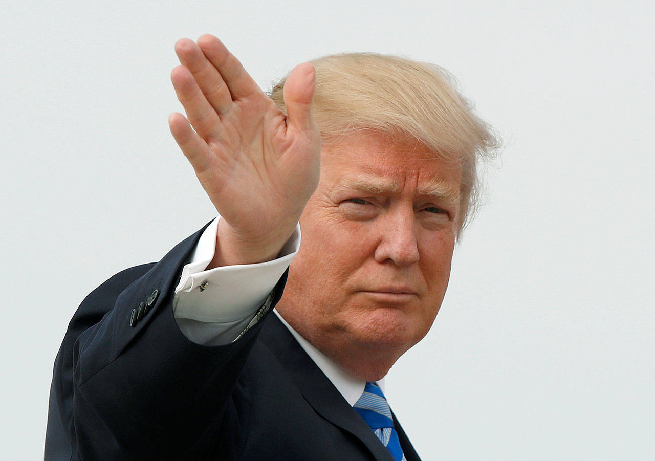 President Donald Trump boards Air Force One before his departure from Andrews Air Force Base, Maryland, on Thursday to his Mar-a-Largo resort in Florida. (AP Photo/Alex Brandon)