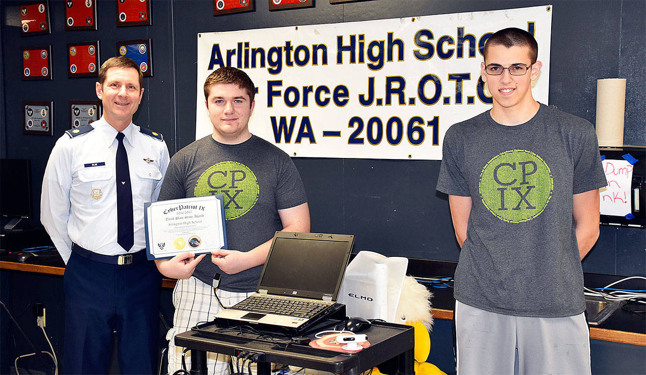 Arlington High School’s Air Force Junior ROTC recently placed third in state in a cyber security defense competition. Pictured from left are senior aerospace science instructor Mike Blue; Cadet Second Lieutenant Cody Barschaw; and Cadet Master Sergeant Zechariah Rodino. (Contributed photo)