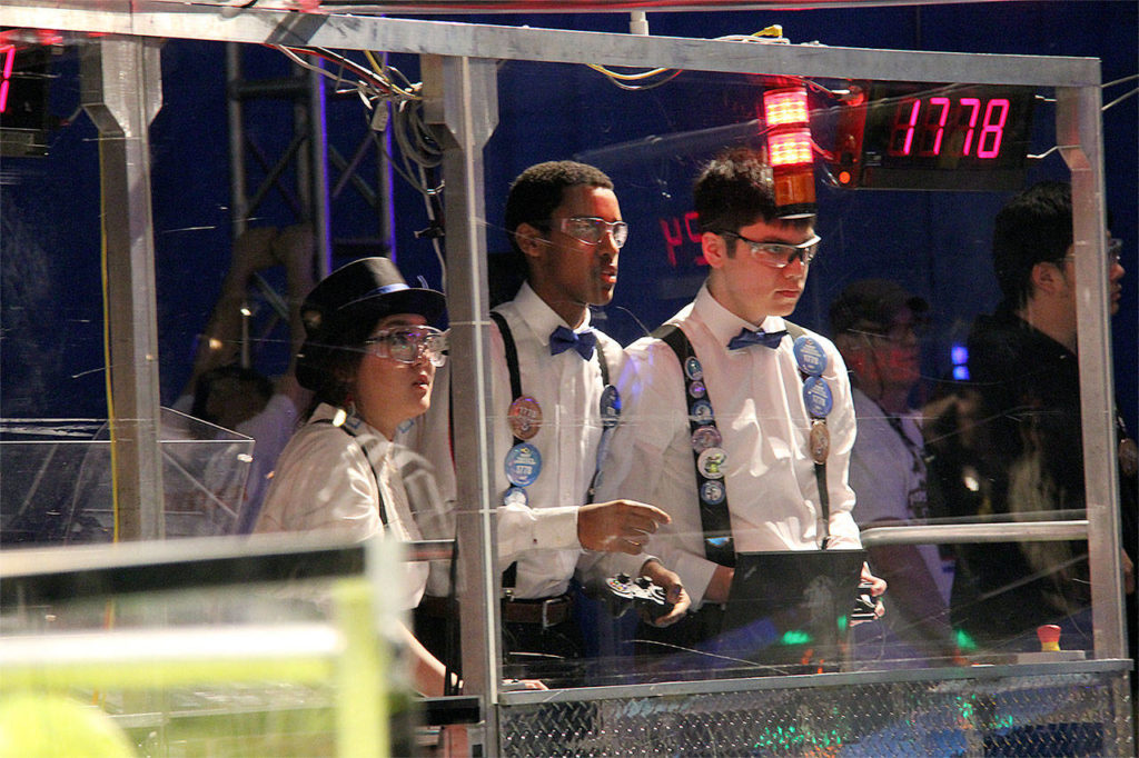 Members of Mountlake Terrace High School’s drive team — from left, Mira Shinn, Teddy Kifelew and Mark Takasuka — work together to operate their robot and develop strategy at the FIRST Robotics Competition world championship in Houston. (Contributed photo)
