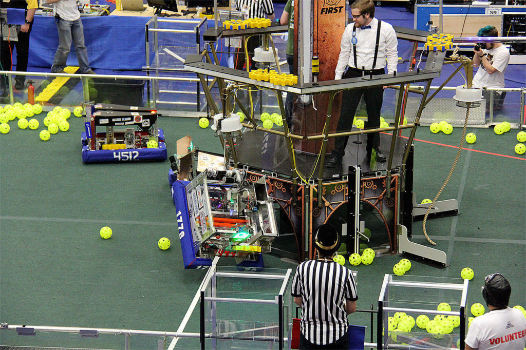 With just seconds to go, the Mountlake Terrace robot (1778) climbs a rope toward “airship pilot” and Chill Out team member Matt Trahms (in the team’s uniform of white dress shirt and suspenders) to score an additional 50 points. (Contributed photo)
