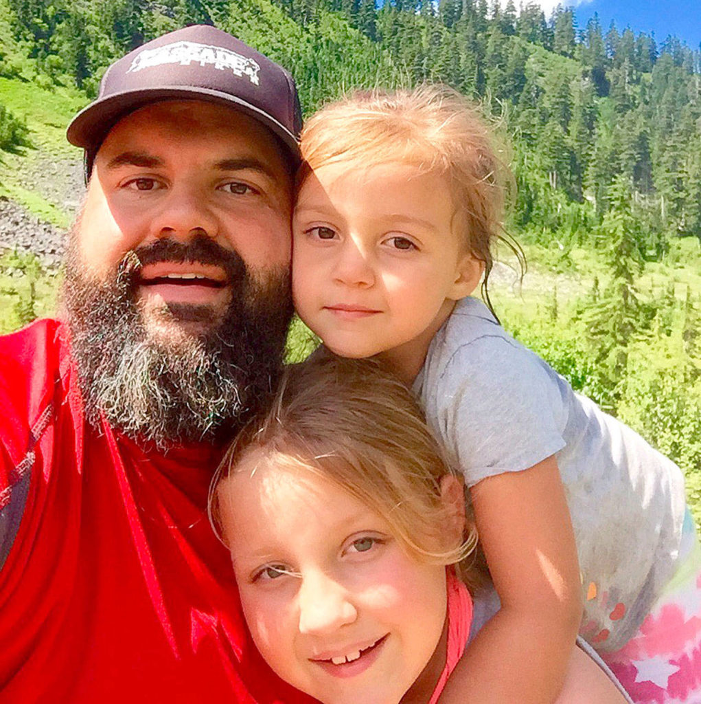 Arlington hiking podcaster Rudy Giecek with his daughters Reggie, 4, and Raichel, 8, who go on weekly hikes with him.
