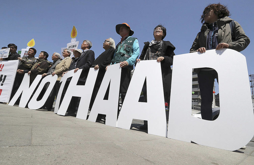 Protesters hold letters reading “NO THAAD” during a rally to oppose a plan to deploy an advanced U.S. missile defense system called Terminal High-Altitude Area Defense, or THAAD, near U.S. Embassy in Seoul, South Korea, on Wednesday, April 26. In a defiant bit of timing, South Korea announced Wednesday that key parts of a contentious U.S. missile defense system had been installed a day after rival North Korea showed off its military power. (AP Photo/Lee Jin-man)
