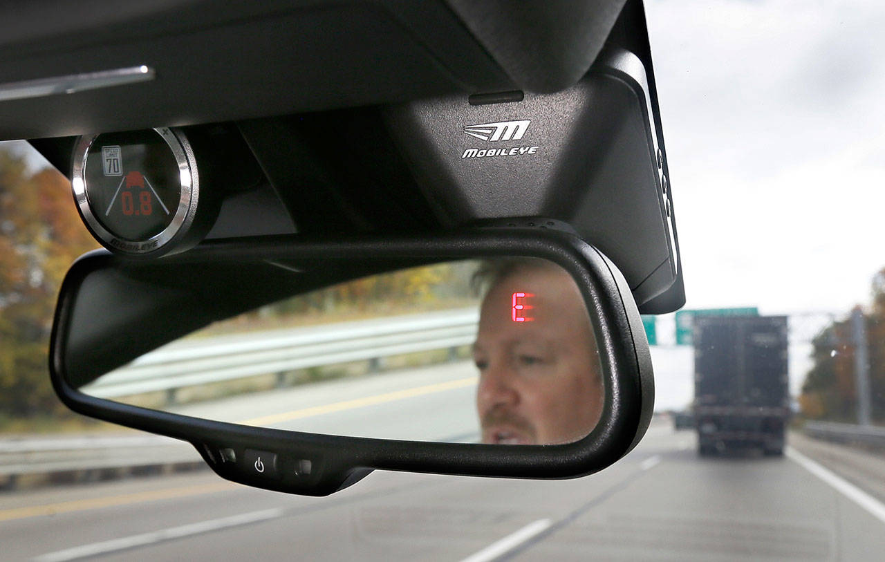 A Mobileye camera system monitors speed limits and warn drivers of potential collisions. For a few hundred dollars, drivers can add new safety technology, like forward collision warning systems or backup cameras, to older cars, which are lasting longer than ever thanks to improving quality. (Associated Press)