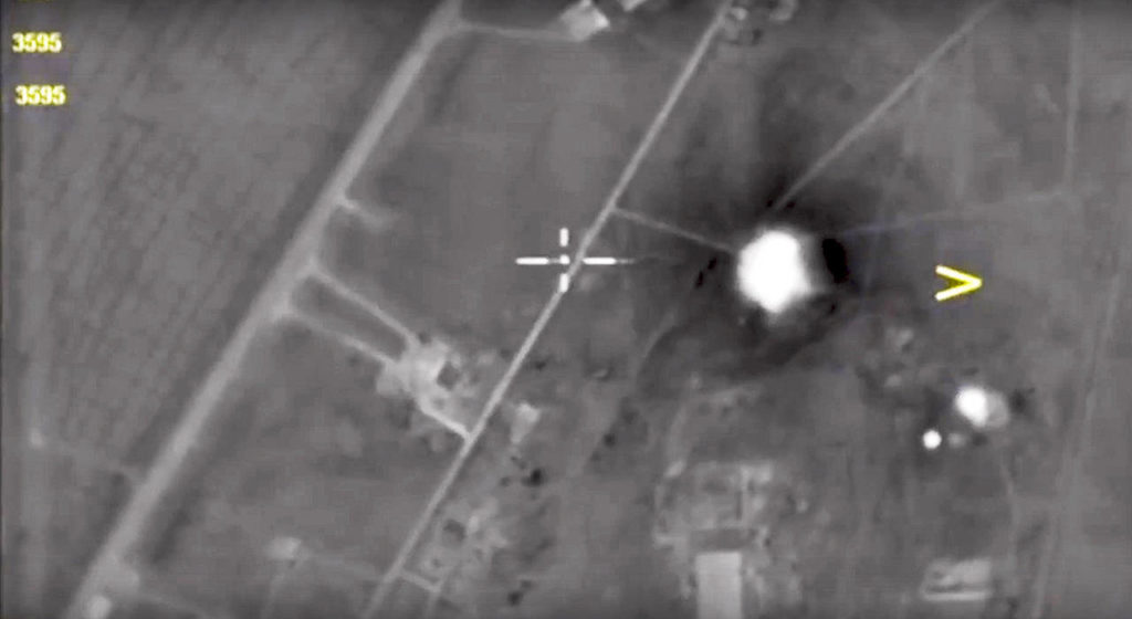 In this photo made from the footage taken from Russian Defense Ministry official web site Friday, April 7, an aerial view shows a Syrian airbase after it was hit by US strike in Syria. (Russian Defense Ministry Press Service Photo via AP)
