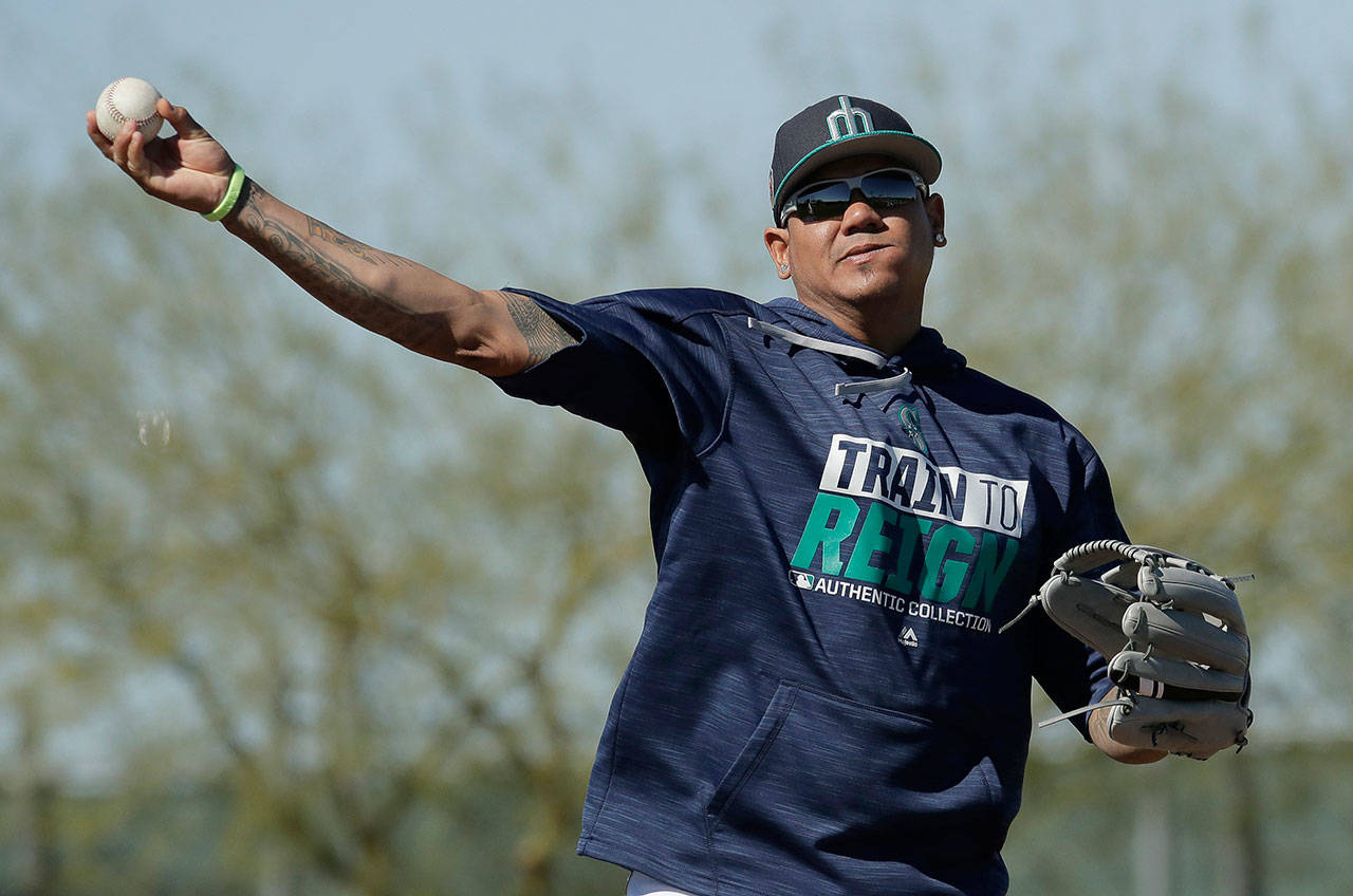 Mariners starting pitcher Felix Hernandez throws a spring training practice on Feb. 15, 2017, in Peoria, Ariz. (AP Photo/Charlie Riedel)