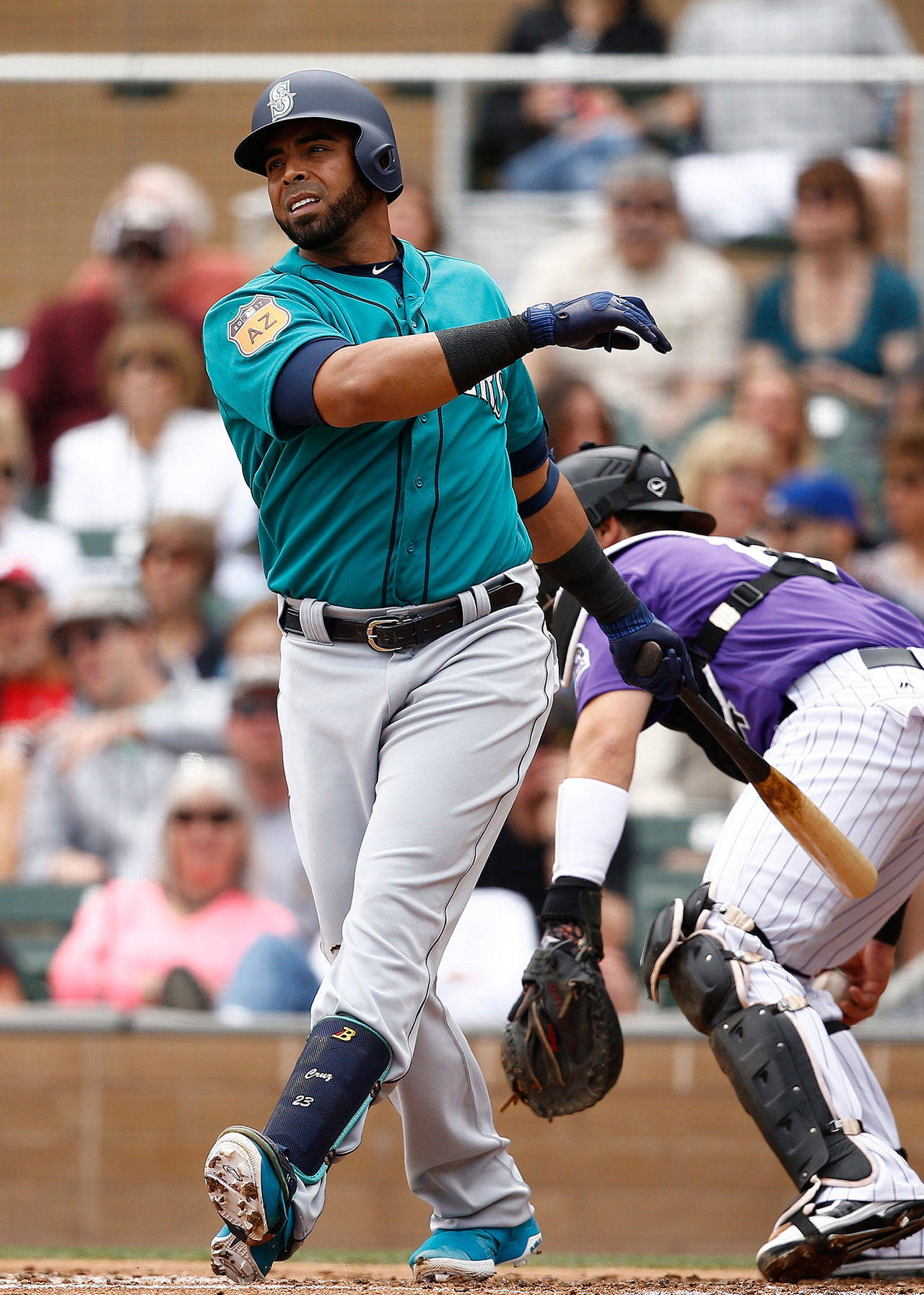 The Mariners’ Nelson Cruz swings and fouls off a pitch during a spring training game against the Rockies on April 1, 2017, in Scottsdale, Ariz. (AP Photo/Ross D. Franklin)