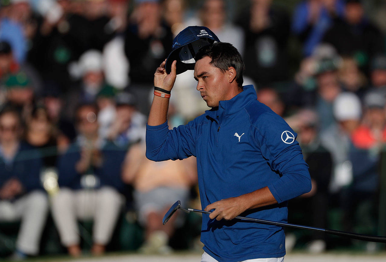 Rickie Fowler tips his hat on the 18th green during the second round of the Masters golf tournament on April 7, 2017, in Augusta, Ga. (AP Photo/Matt Slocum)