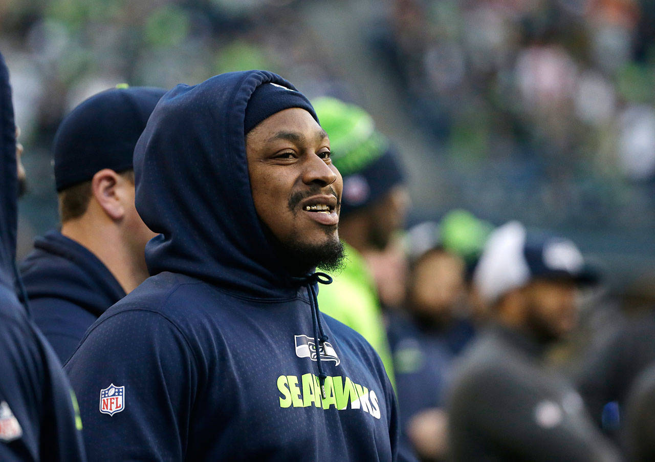 Seahawks running back Marshawn Lynch watches from the sideline during a game against the 49ers on Nov. 22, 2015, in Seattle. (AP Photo/Elaine Thompson)
