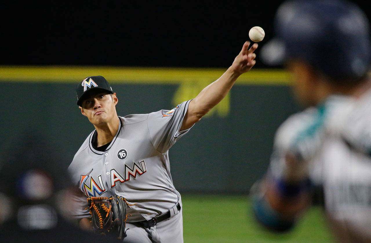 The Marlins’ Wei-Yin Chen pitches to Mariners’ Robinson Cano during the fourth inning of a game April 18, 2017, in Seattle. (AP Photo/Ted S. Warren)