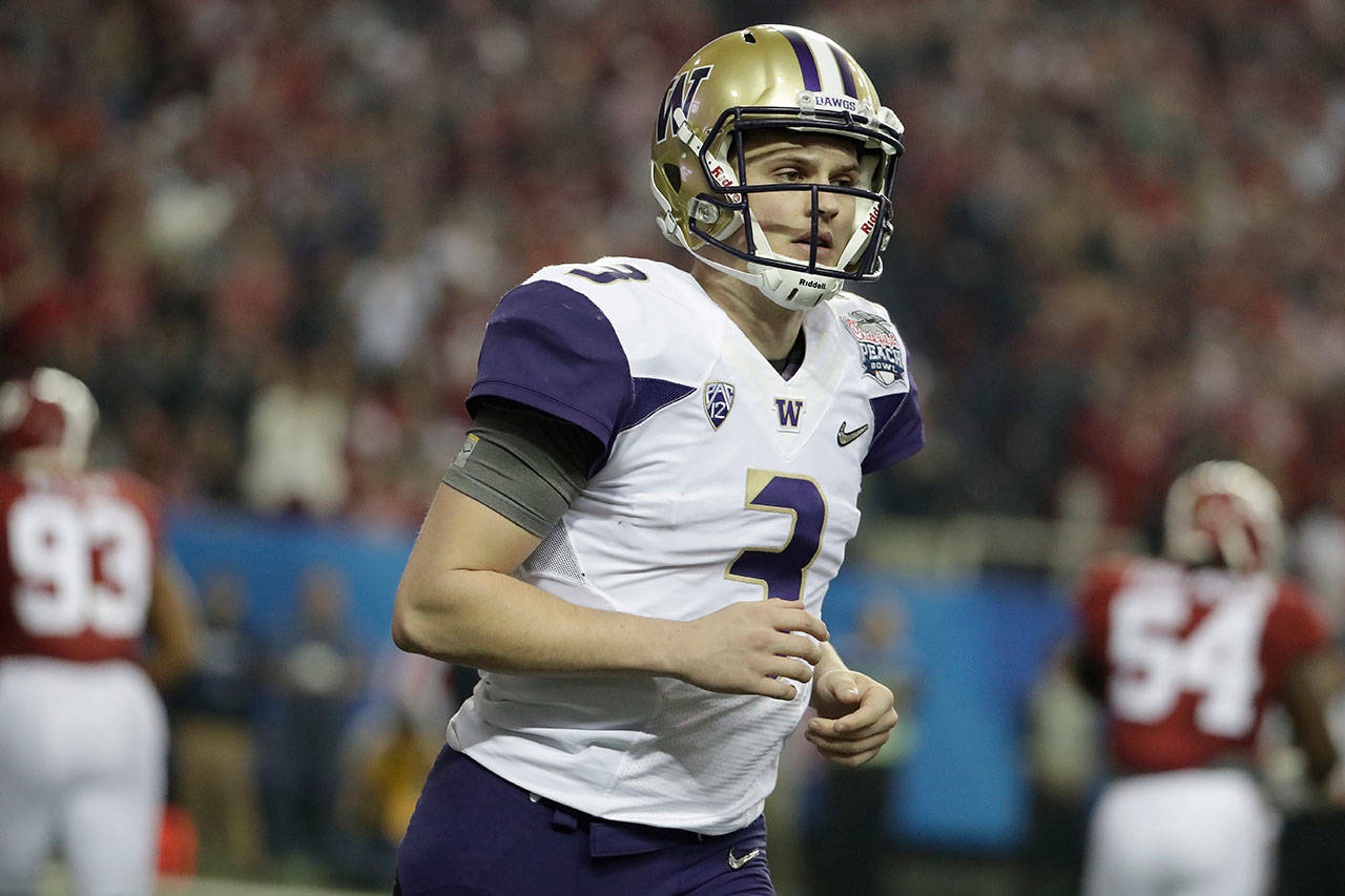 Washington quarterback Jake Browning (3) runs off the field against Alabama during the first half of the Peach Bowl on Dec. 31, 2016, in Atlanta. (AP Photo/David Goldman)