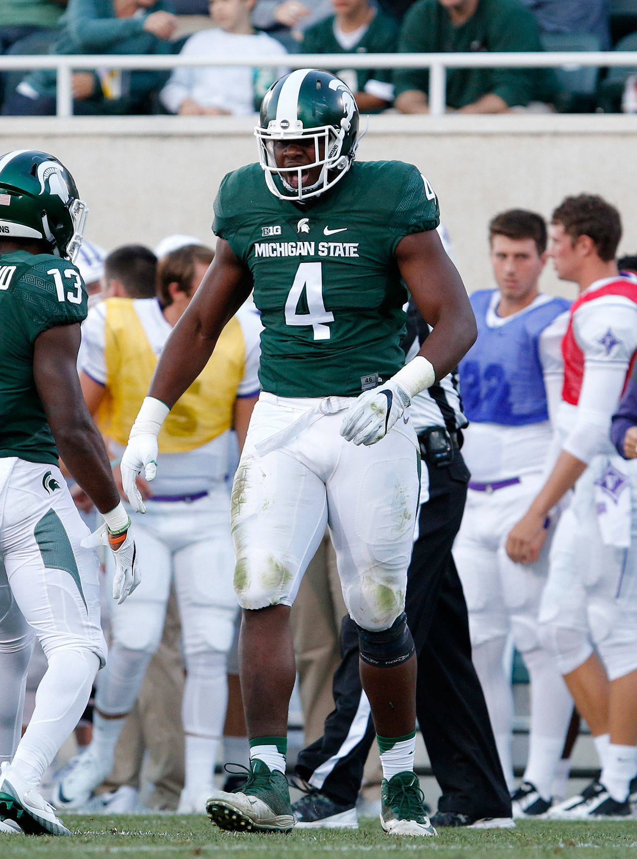 Michigan State’s Malik McDowell (4) celebrates a play during a game against Furman on Sept. 2, 2016, in East Lansing, Mich. (AP Photo/Al Goldis)