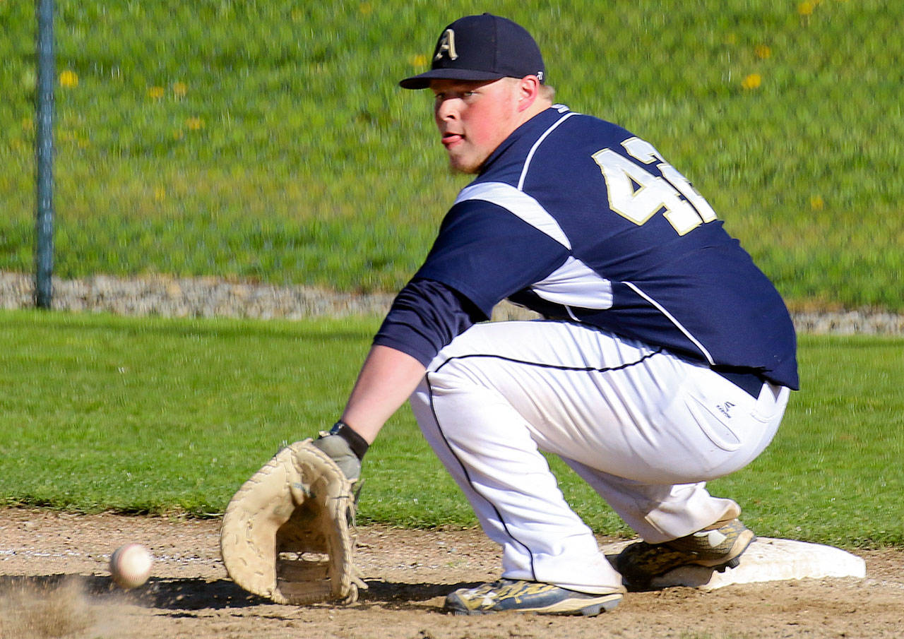 Arlington’s Branden Perdue digs for a throw to first base during a game against Shorewood on April 21, 2017, in Arlington on April 21, 2017. (Kevin Clark / The Herald)