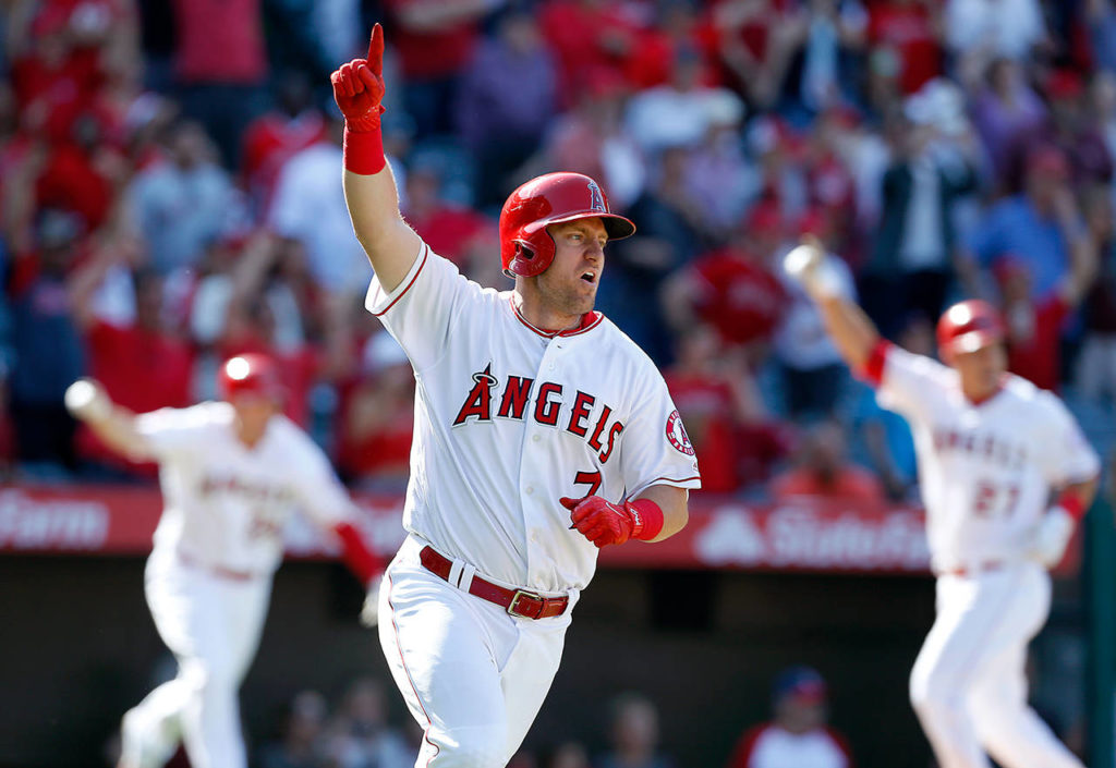 Los Angeles Angels’ Cliff Pennington (7) celebrates after getting the game-winning hit in the ninth inning of a baseball game against the Seattle Mariners, Sunday, April 9, in Anaheim, Calif. The Angels won 10-9 after scoring seven runs in the ninth inning. (AP Photo/Christine Cotter)
