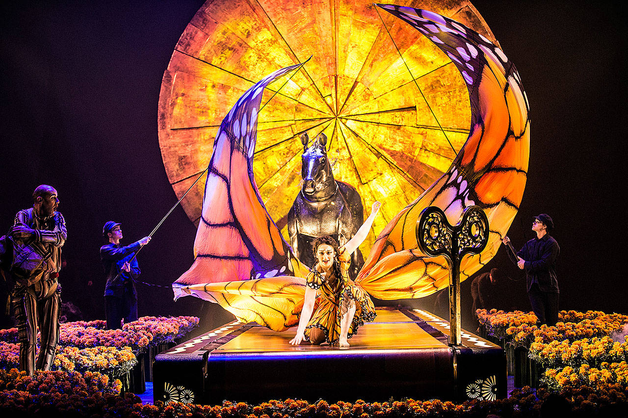 Shelli Epstein spreads her “butterfly wings” while running on an oversized treadmill in Cirque du Soleil’s “Luzia.” The show opened March 30 at Redmond’s Marymoor Park. (Matt Beard photo)