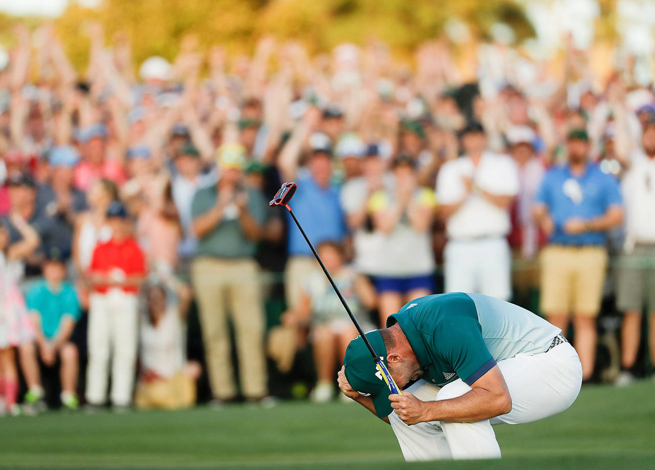 Sergio Garcia, of Spain, reacts after making his birdie putt on the 18th green to win the Masters golf tournament after a playoff Sunday, April 9, in Augusta, Ga. (AP Photo/Matt Slocum)