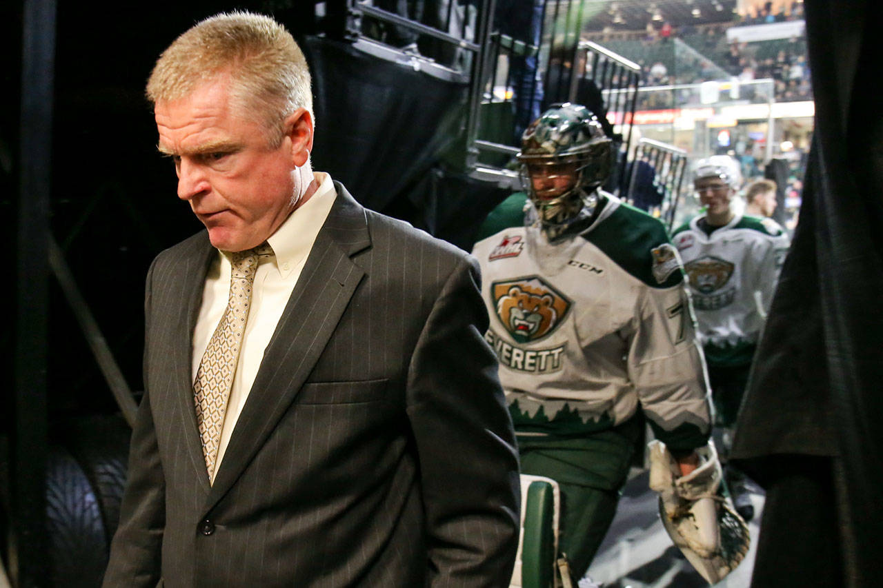 Everett head coach Kevin Constantine leads his team off the ice after the Silvertips lost to the Seattle Thunderbirds 4-3 in Game 2 of their Western Hockey League playoff series April 8 in Everett. (Kevin Clark / The Herald)