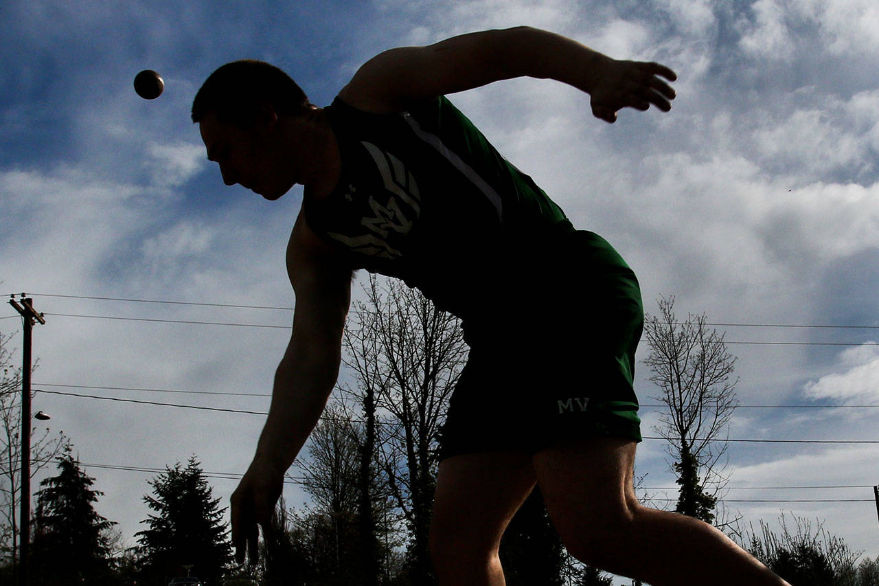 Mount Vernon senior Blayne Plessner lets the shot put fly during a Wesco 4A track meet with Cascade and Jackson on Thursday at Everett Memorial Stadium. Plessner’s best throw of 41 feet, 2 inches was good enough for third, behind first-place Andrew Raymond of Cascade (42-5.75) and Mount Vernon’s Daniel Carrillo (41-7.25). Plessner also finished sixth in the discus and ninth in the javelin on Thursday. (Kevin Clark / The Herald)