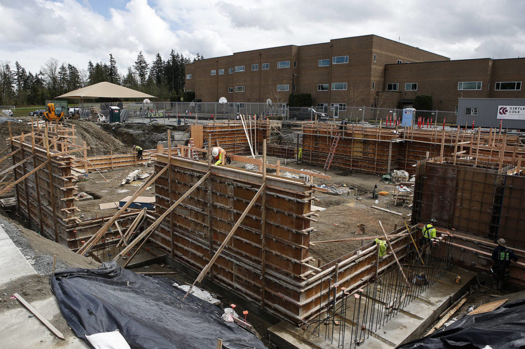 Construction commences on Northshore Christian Academy’s new school building in Mukilteo on April 12. The new $3.3 million section of the private school is on track to open for the 2017-18 school year. (Ian Terry / The Herald)
