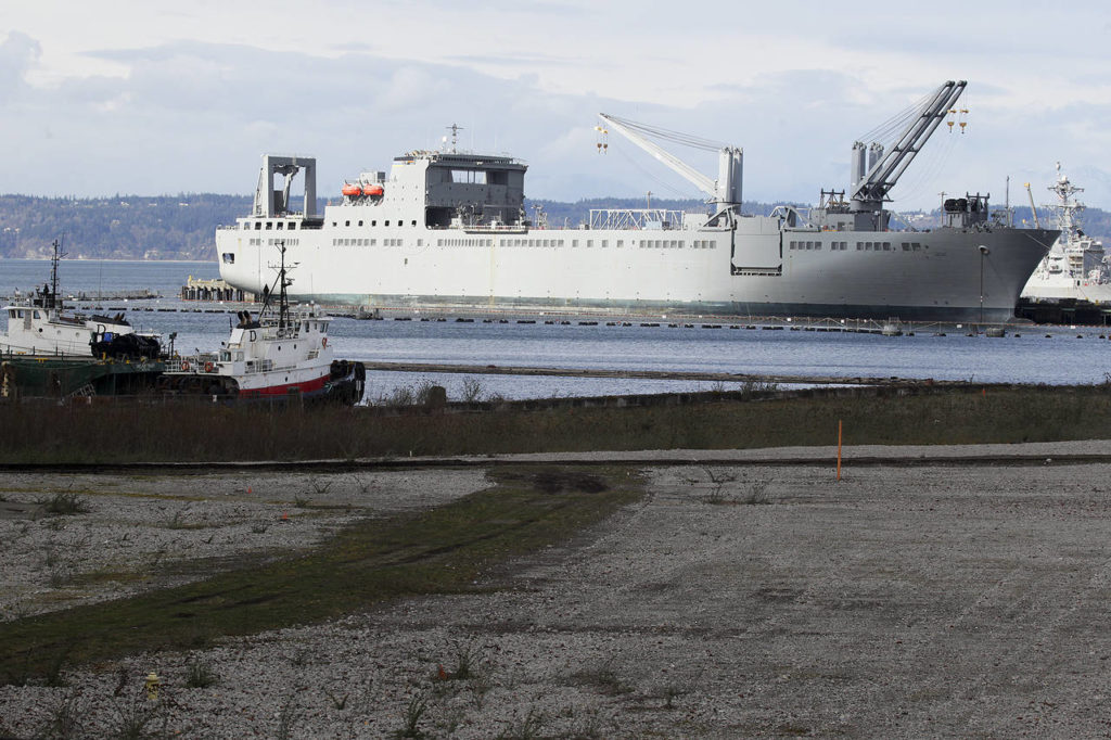 Navy vessels are seen along with part of the empty lot which used to be home to the Everett Kimberly-Clark mill. (Ian Terry / The Herald)
