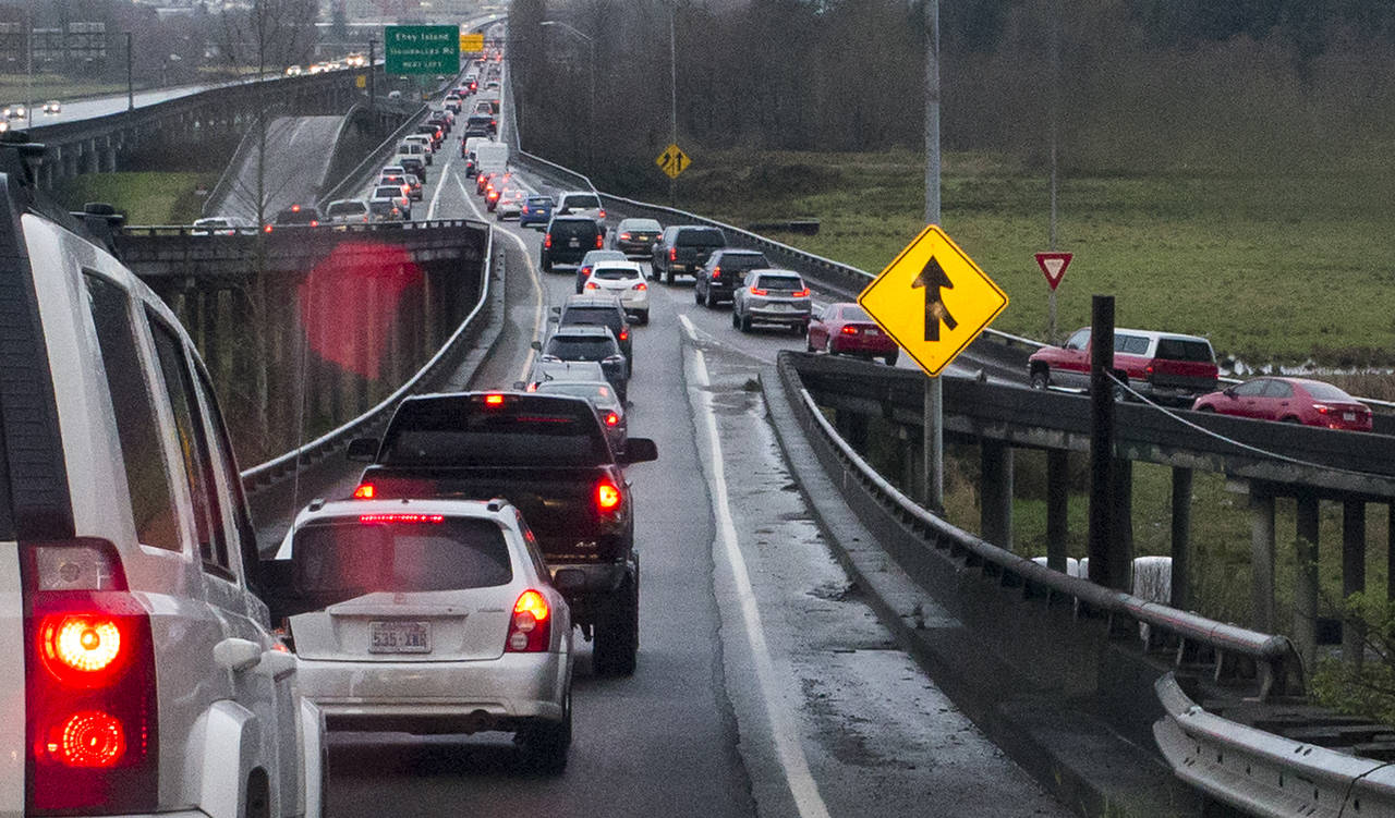 Westbound cars merge from Highway 204 and 20th Street Southeast onto the trestle during the morning commute on Thursday in Lake Stevens. (Ian Terry / The Herald)