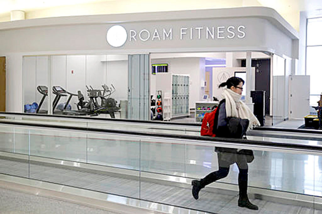 A traveler walks past the recently opened ROAM Fitness gym at Baltimore-Washington International Thurgood Marshall Airport. (Patrick Semansky / Associated Press)
