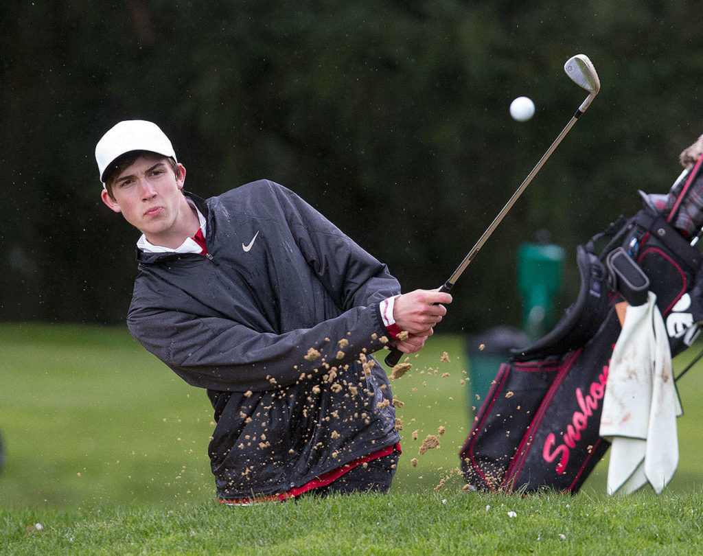 Snohomish&rsquo;s Nolan Armbruster hits out of a bunker Monday during the Dolan Invitational at Everett Golf & Country Club. (Andy Bronson / The Herald)

